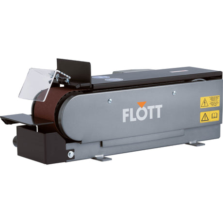 Levigatrice a nastro Flott TBSM 100 con nastro da 1220 x 100 mm, motore da 0,75 kW e attacco aspirazione Ø 35 mm, ideale per levigatura e sbavatura di precisione.